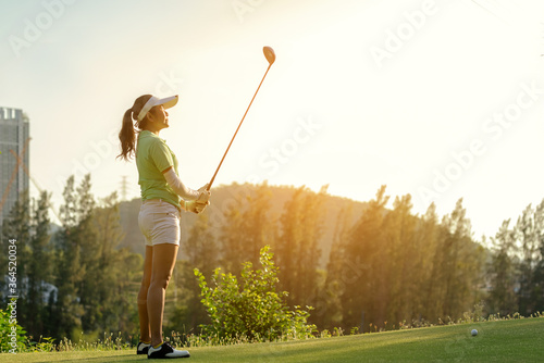 Golfer sport approach on course golf ball fairway.  People lifestyle woman playing game golf