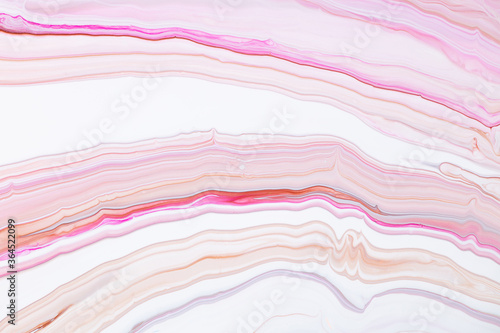Fluid art texture. Abstract background with mixing paint effect. Liquid acrylic picture with artistic mixed paints. Can be used for baner or wallpaper. Pink, white and coral overflowing colors