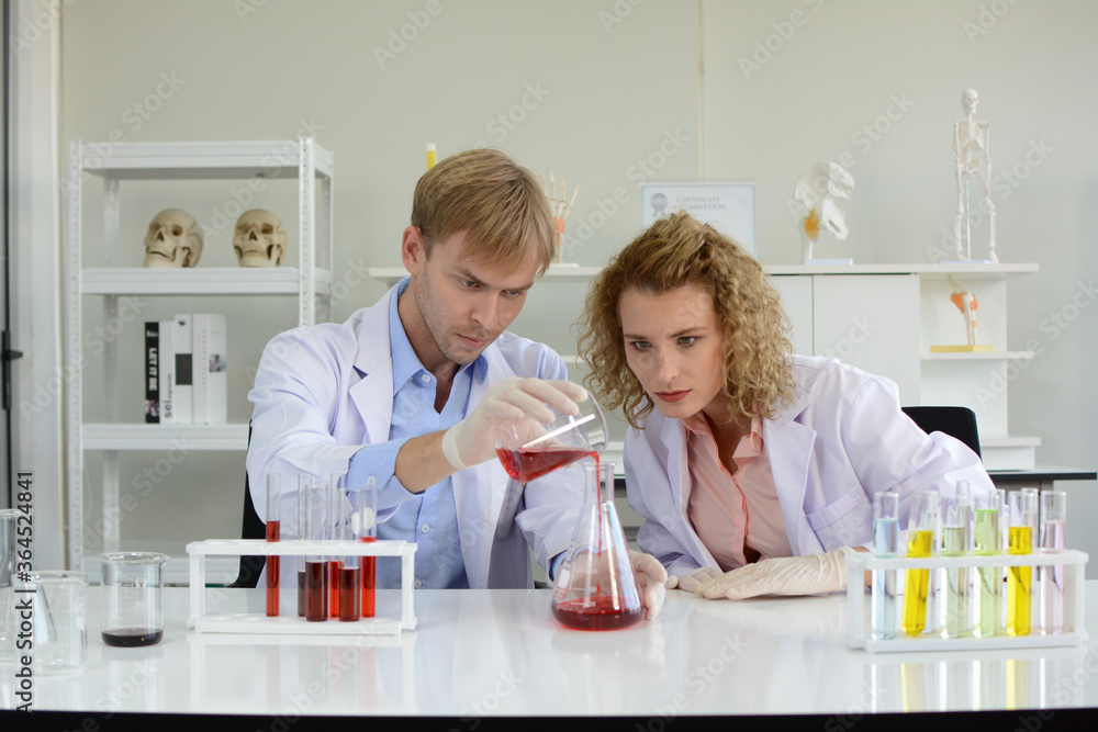 Scientists studying new substances in lab. Scientists studying new substances in lab.