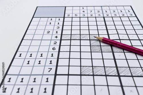 Принти на полотні Paper pastime called nonogram, picross, griddlers, hanjie or paint by numbers
