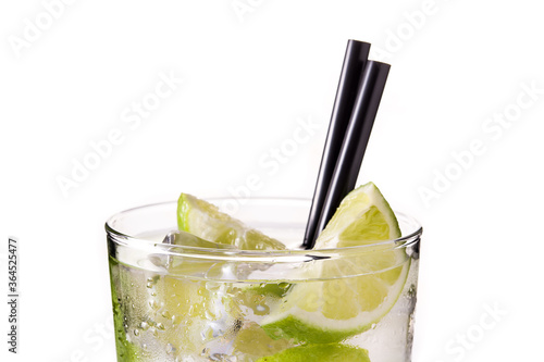 Caipiroska cocktail with lime isolated on white background. Close up