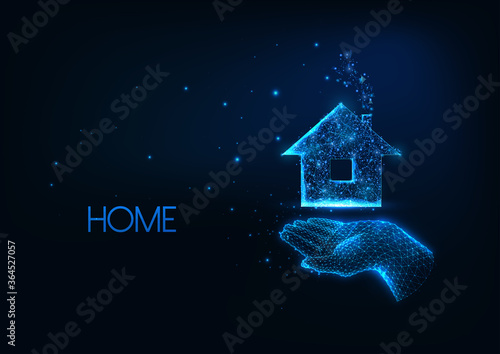 Futuristic real estate, home purchase concept with glow low poly hand holding residential building
