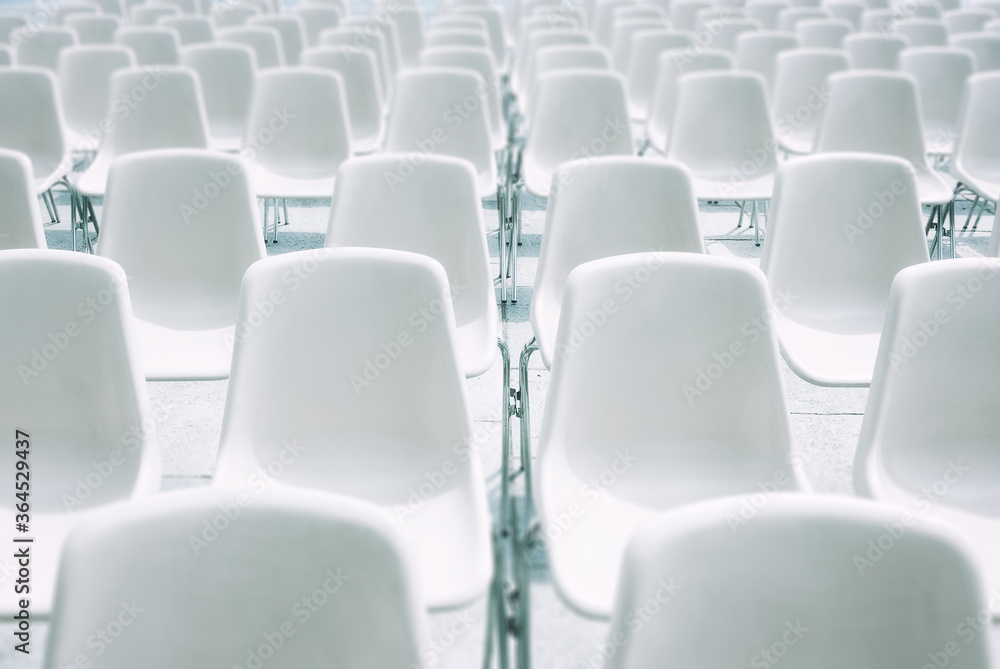 Stalls of white plastic and steel chairs for outdoor events Stalls of white plastic and steel chairs for outdoor events