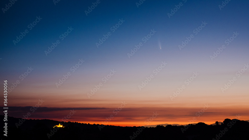 Comet Neowise above a beautiful sunrise in Spain.  