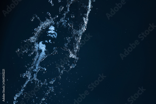 Water Splash With Motion Blur Effect Over Black Background
