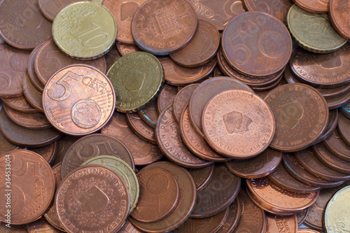 Money: a lot of brown colored 5 euro cent coins photo