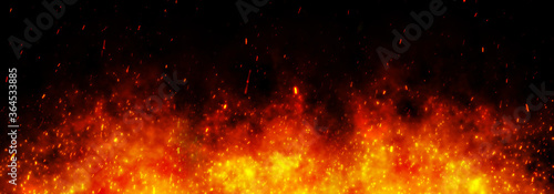 Fire embers particles over black black background. Fire sparks background. Abstract dark glitter fire particles lights. 