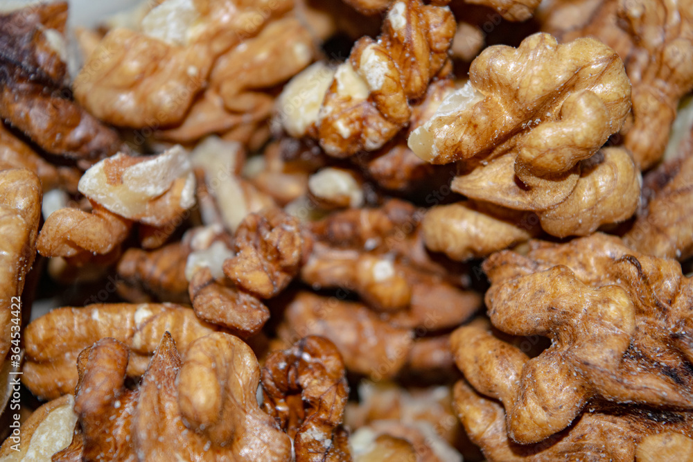 Peeled walnuts close-up. Surface texture. Healthy diet. Peeled walnuts close-up. Surface texture. Healthy diet.