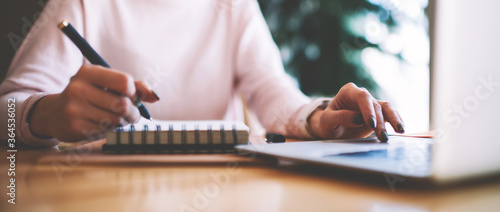 Bilde på lerret Selective focus on hipster girl writing interesting ideas for scenario for schoo