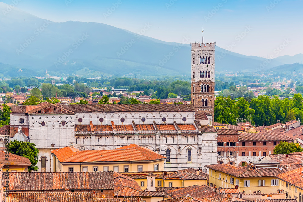 A view from the Guinigi Tower towards the side elevation of St Martin Cathedral in Lucca, Italy in summer