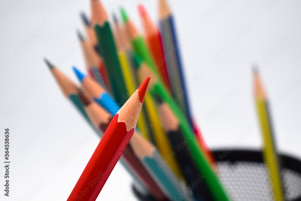 Close up picture of some different colored wood pencil crayons in a jar Close up picture of some different colored wood pencil crayons in a jar