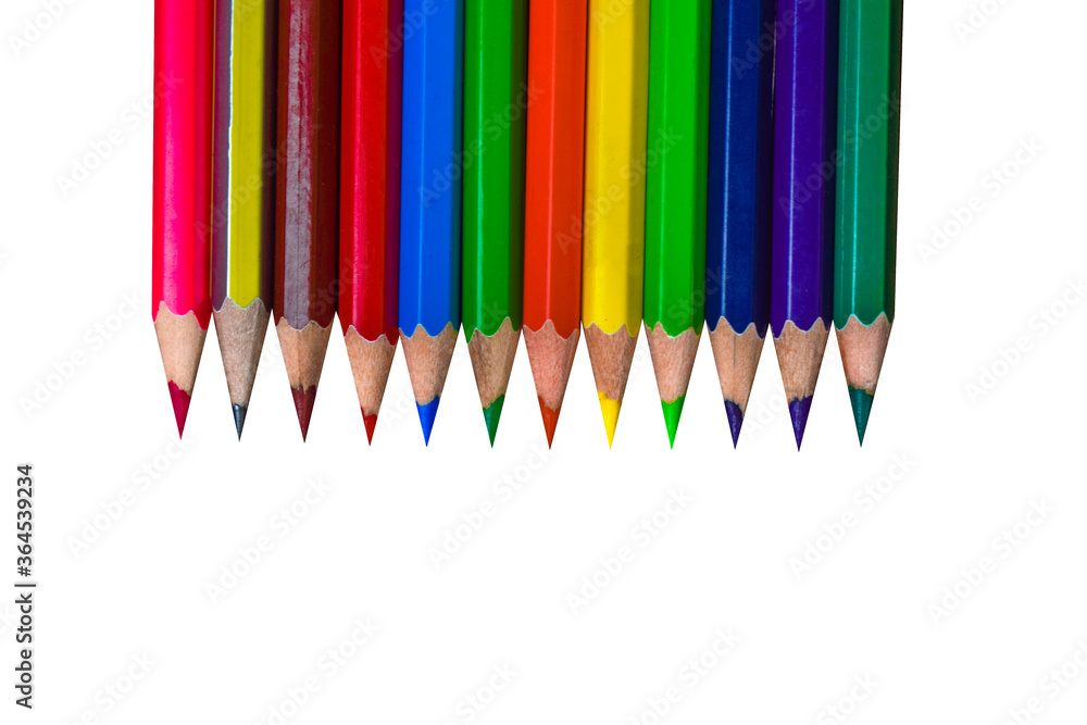 Line of different colored wood pencil crayon placed on top of a white background Line of different colored wood pencil crayon placed on top of a white background
