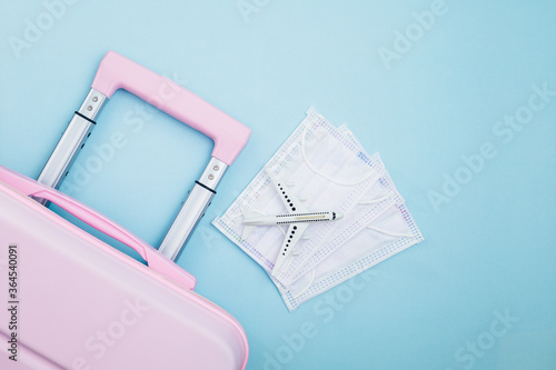 Pink luggage with white air...