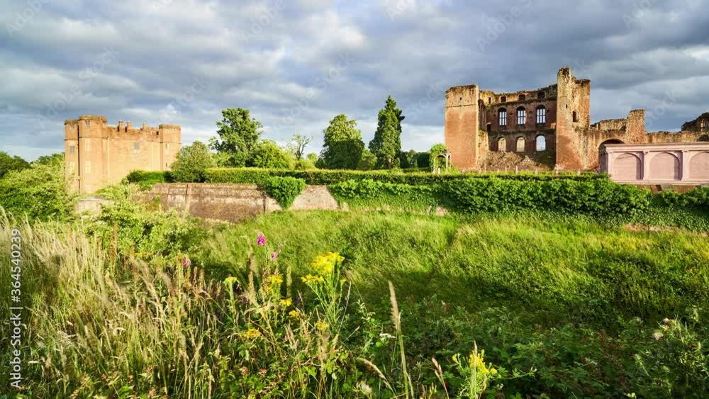 Kenilworth castle ruins TIMELAPSE with fast moving clouds and flowers. Warwickshire, England, UK Kenilworth castle ruins TIMELAPSE with fast moving clouds and flowers. Warwickshire, England, UK