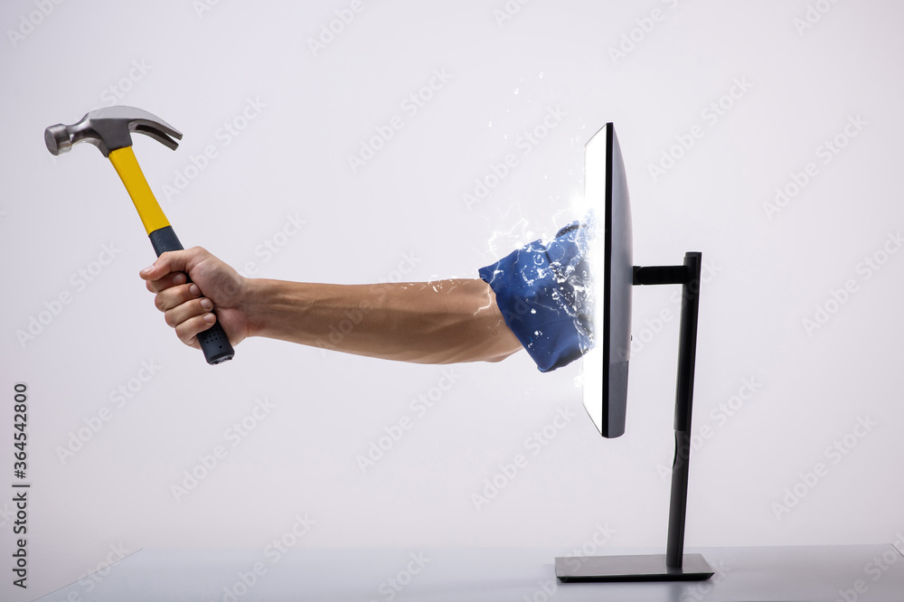 Hammer in hand sticking out of monitor isolated on white - online helping  hand foto de Stock | Adobe Stock
