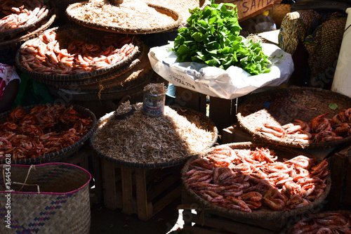dried fish in baskets at market in nosy be madagascar photo