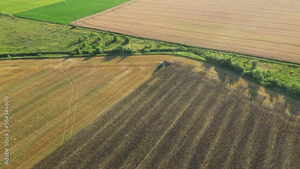 Tractor Cultivating Earth After Harvesting Tractor Cultivating Earth After Harvesting