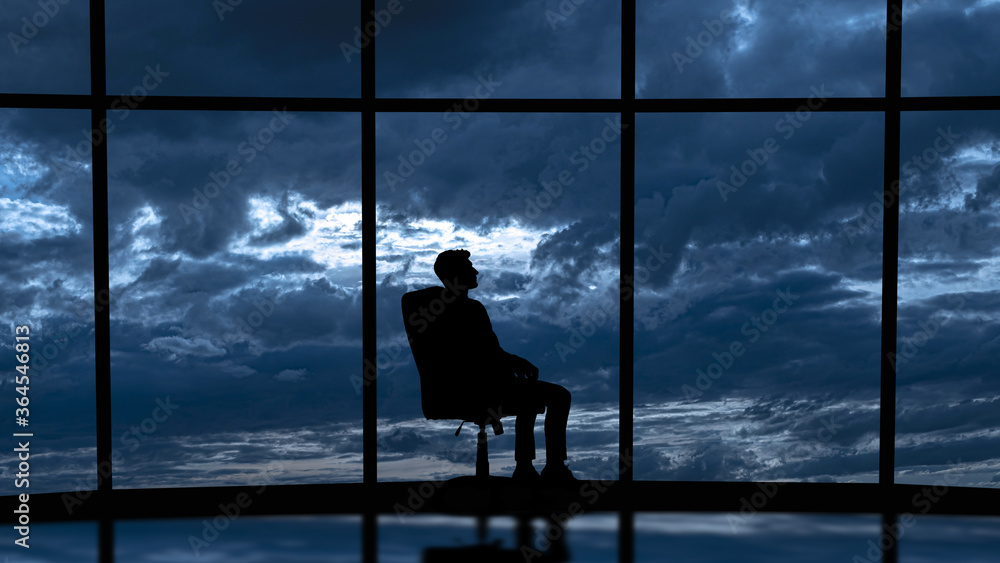 The business man is sitting in the office near the window with a scenic sky view The business man is sitting in the office near the window with a scenic sky view
