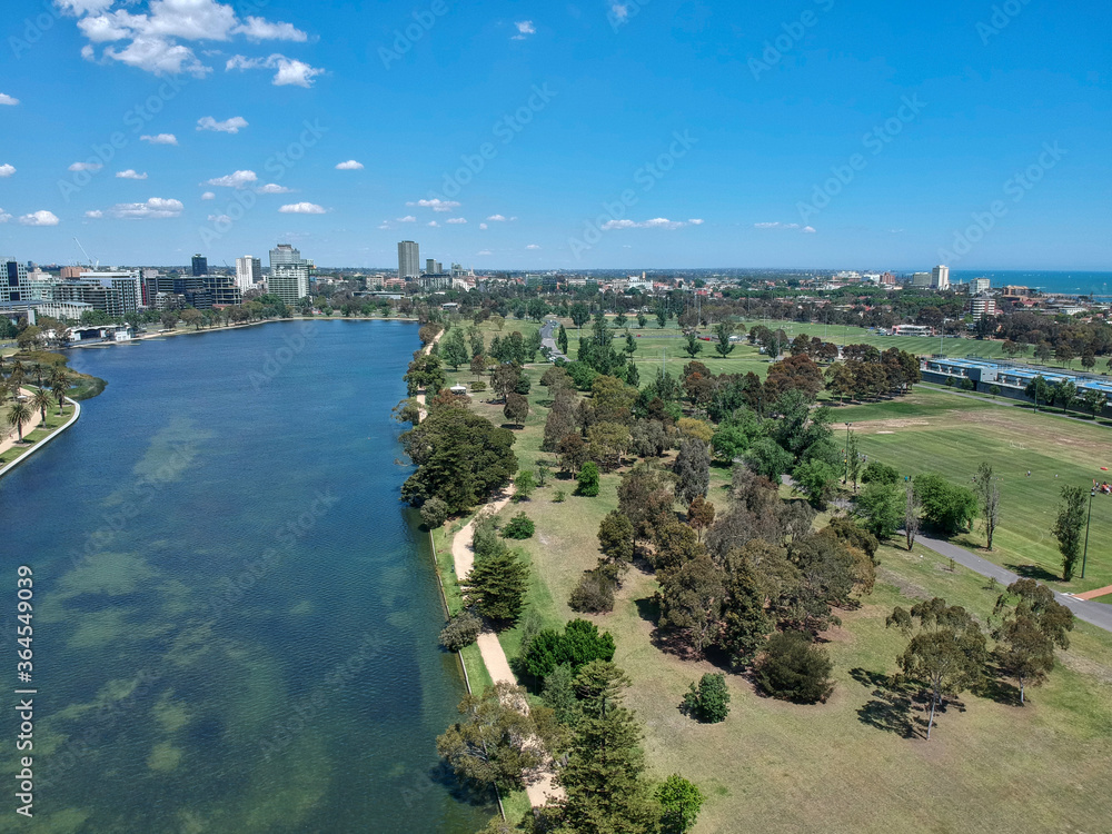 Aerial view of a beautiful sunny day at the Albert Park and Lake, with the golf course and Melbourne Skyline