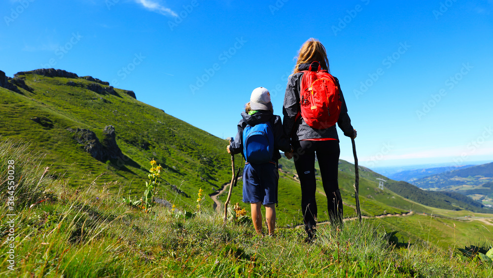 hiking trail, family with backpack- Plomb du Cantal, Auvergne-Cantal.
