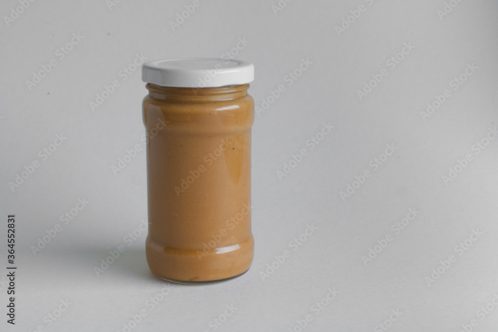 jar of peanut butter on white background jar of peanut butter on white background
