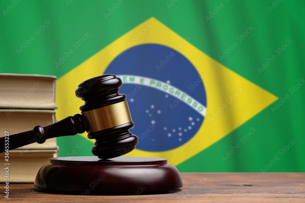 Justice and court concept in Federative Republic of Brazil. Judge hammer on a flag background