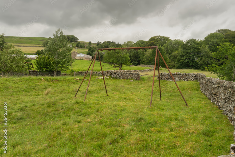 Old swing frame at abandoned recreation ground at Garrigill, Cumbria Old swing frame at abandoned recreation ground at Garrigill, Cumbria