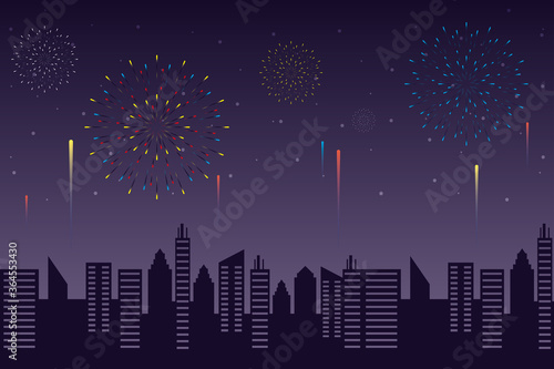 Fireworks burst explosions with citycape in night sky background