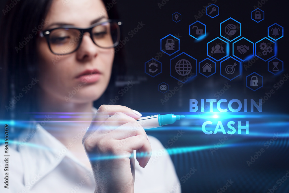Business, Technology, Internet and network concept. Young businessman working on a virtual screen of the future and sees the inscription: Bitcoin cash Business, Technology, Internet and network concept. Young businessman working on a virtual screen of the future and sees the inscription: Bitcoin cash