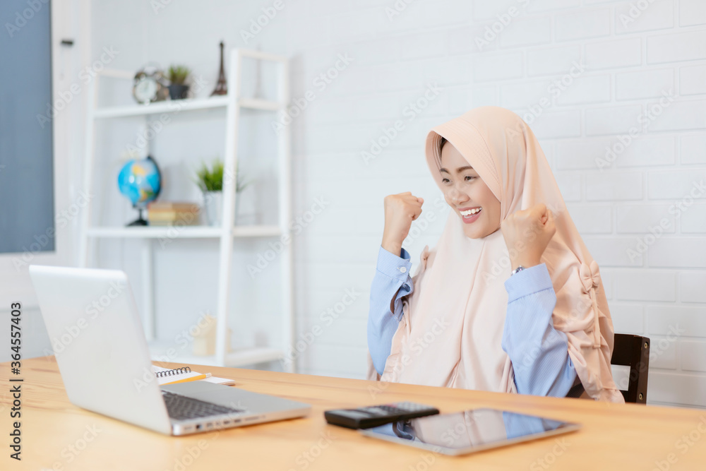 Muslim Islamic hijab women working with finance calculate on calculator.calculate inspector, finance, account concept, entrepreneur Startup use calculator calculating financial expense office Muslim Islamic hijab women working with finance calculate on calculator.calculate inspector, finance, account concept, entrepreneur Startup use calculator calculating financial expense office