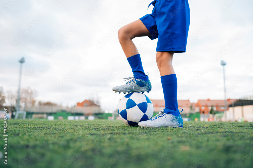 Low angle side view of unrecognizable teenage girl in white and