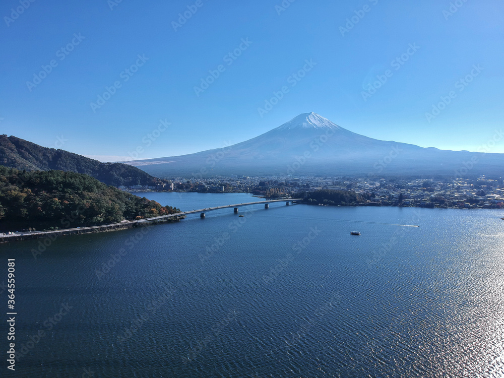 A beautiful day at Lake Kawaguchi with a clear sky showing the impressive Mount Fuji in the background