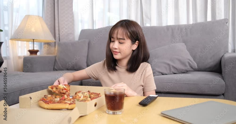Young asian woman takeaway junk food eating pizza with drinks cola. Young asian woman takeaway junk food eating pizza with drinks cola.