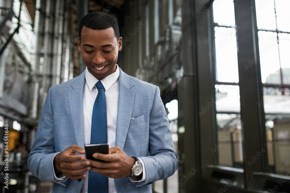 Trendy black businessman using phone Trendy black businessman using phone