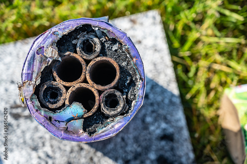 Top of cardboard burnt firework tubes photo