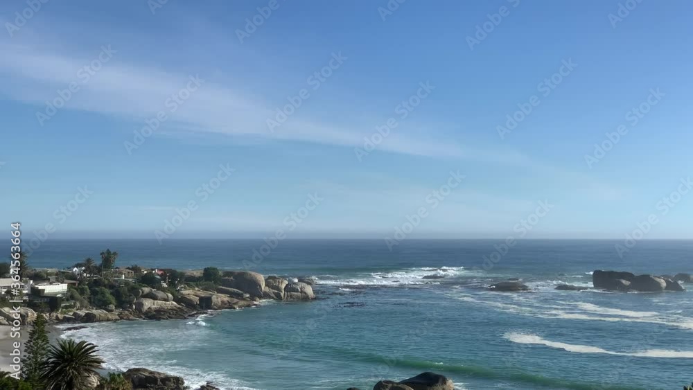 Closeup view of Clifton fourth beach with big boulders dividing it with Maidens Cove On the Cape Peninsula Closeup view of Clifton fourth beach with big boulders dividing it with Maidens Cove On the Cape Peninsula