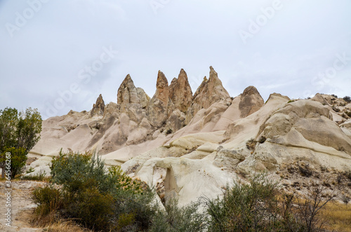 Photo of beautiful unique Mountain landscape with fairy chimneys in Goreme, Cappadocia, Turkey