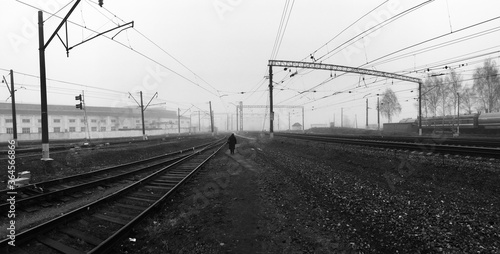 Abstract russian railway depressive cityscape with lonely old women figure