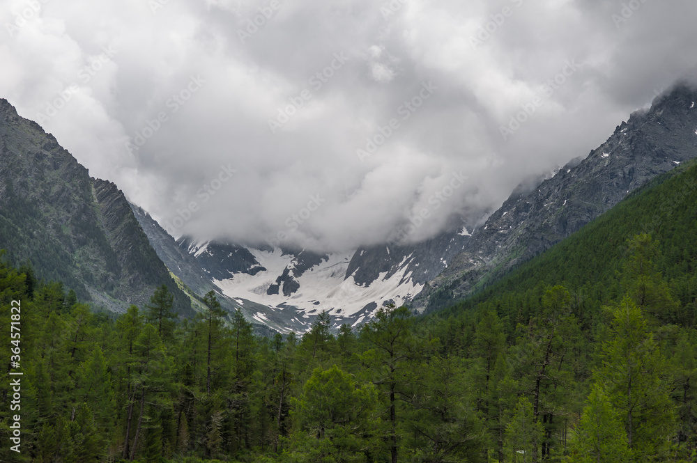 huge clouds in the mountains in the Altai Mountains