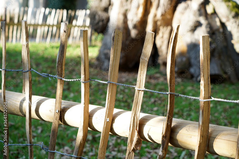 Fototapeta premium Handcrafted fence photographed outdoors in the best of daylight