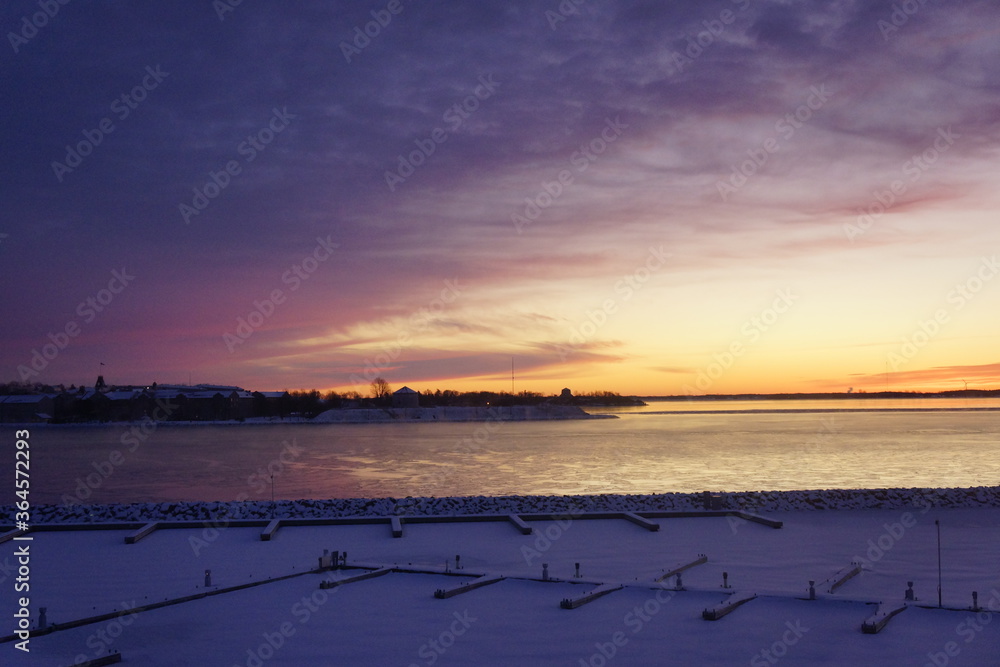 Sunset in winter over Kingston marina in Canada.