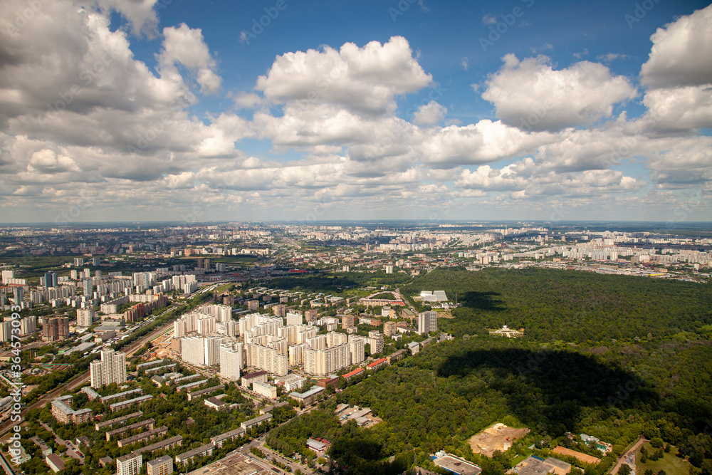 An aerial view shows the residential areas and surrounding green space of Moscow, Russia in the summer.