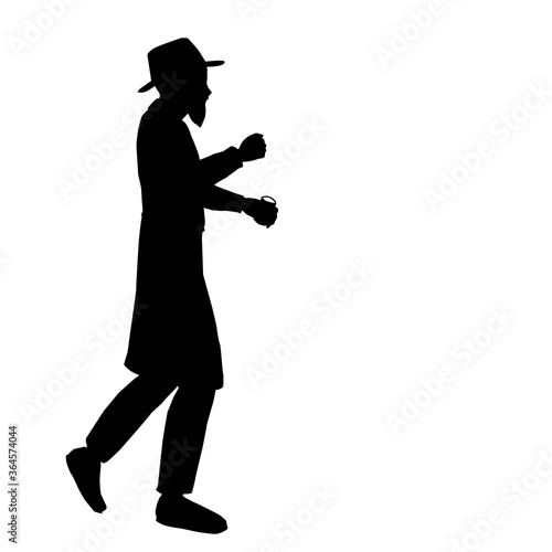 Black silhouette of a man, Hasidic Orthodox Jew holding a glass of vodka.