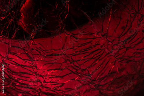 Cracked red glass texture, background