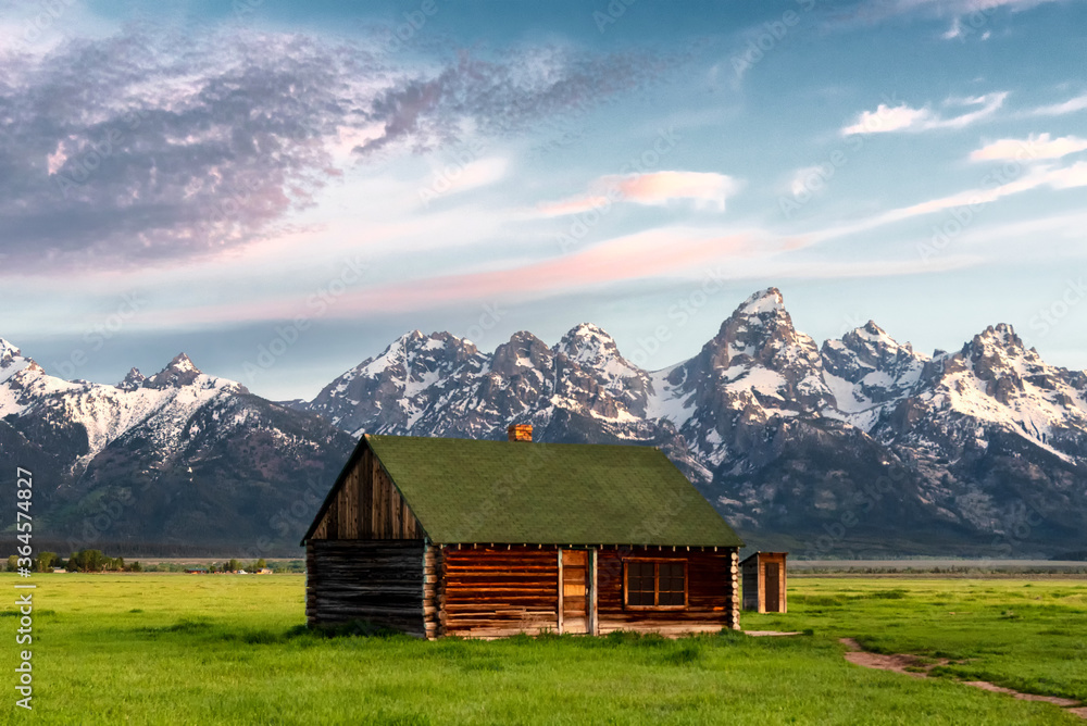 Mormon Row in Jackson Hole, Wyoming on a partially cloudy day Mormon Row in Jackson Hole, Wyoming on a partially cloudy day