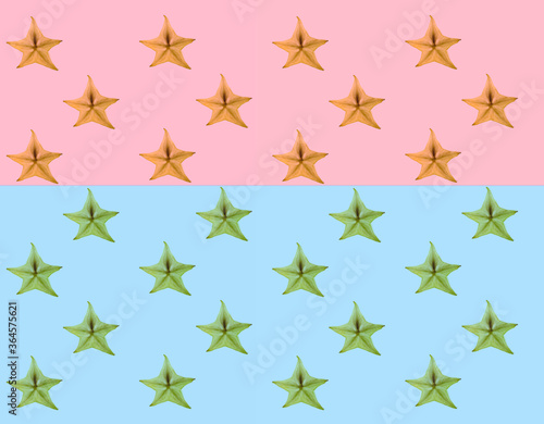 Pattern of fresh fruits slices on pastel background from top view.