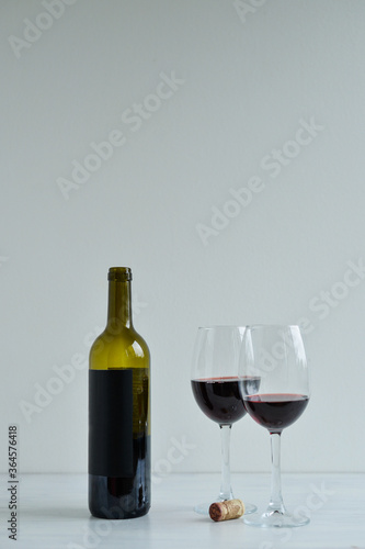 Red wine standing one the white table