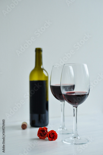 Red wine standing one the white table