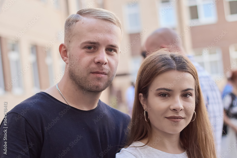 portrait of a young couple of students blonde and brunette portrait of a young couple of students blonde and brunette