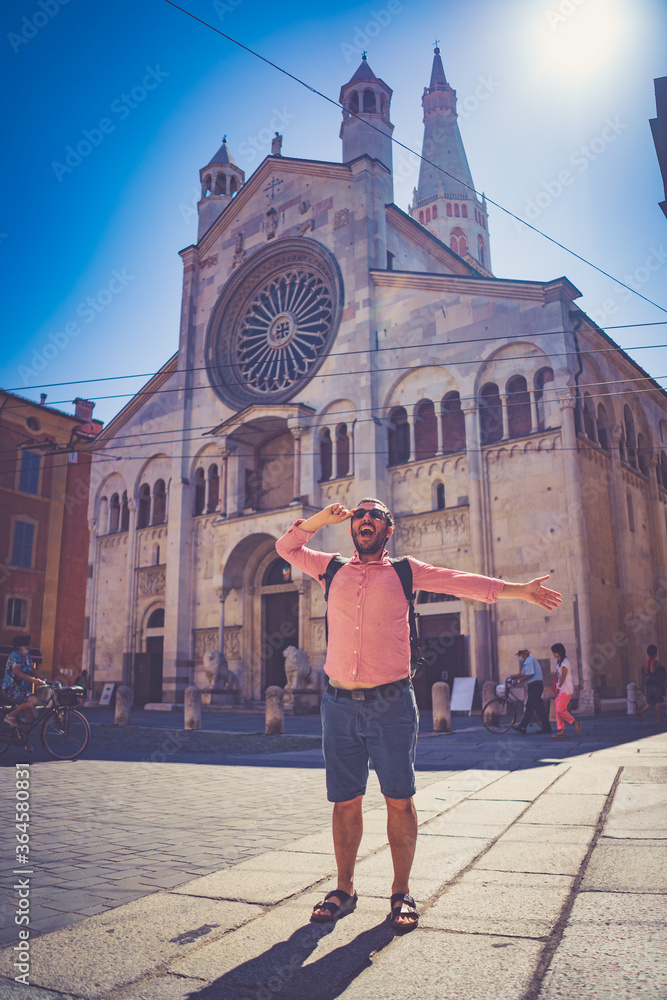 happy Tourist visit city center of Modena in the main square of the city. Major destination in Emilia-Romagna, Italy